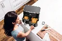 JPG-AF451EU_InUse_OnIsland_Overhead_TwoWholeChickens_Woman_CMYK.webp