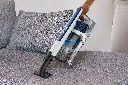 JPG-R_IZ380EU_In Use_Living room_Sofa_Upholstery Tool_Man.webp
