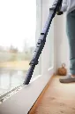 JPG-R_IA3241EUT_InUse_AbvFlr_Window_CreviceTool_Woman.webp