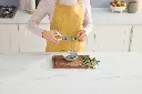 DAT-K62006EUUKWH_InUse_Knife_Shears_Cutting_Woman CMYK.webp