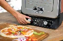 JPG-R_OO101EU_InUse_Setting_thin_crust_pizza_Woman2_CMYK.webp