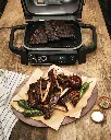 JPG-OG701EU_InUse_Smoker_RibsPlated_OnTable CMYK RT.webp