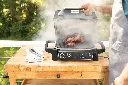 JPG-OG701EU_InUse_Dad_SmokeChicken_LidOpenFull CMYK RT.webp