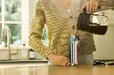 JPG-R_DW1603EUUKGN_InUse_Kitchen_Woman_Pouring_Coffee_Cutaway.webp