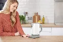 JPG-KT200EUWH_White Kettle_InUse_Pressing UI_Woman_Wide_6_rt.webp