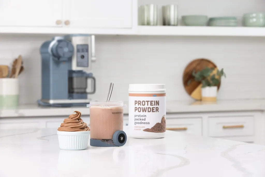 JPG-R_NC702EU_InUse_Kitchen_OnIsland_LineUp_Protein_Powder.webp