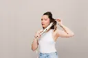 JPG-R_HD440SLEUSeries_InUse_OvalBrush_Chloe_Styling_Angled.webp